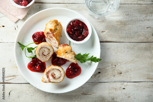 Homemade chicken rolls with cranberry sauce photo