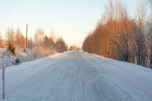 Frozen road in Karelia and majestic winter forest