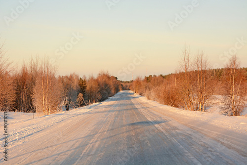 Frozen road in Karelia and majestic winter forest