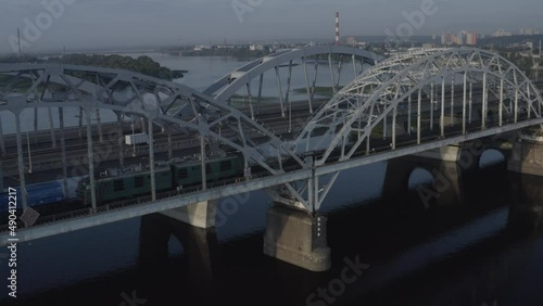 Darnitsky automobile bridge. The city of Kiev. Ukraine. Across the Dnieper River. Video from the drone. Top view of the exits from the bridge. Traffic	
 photo