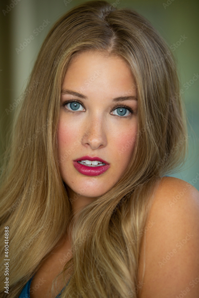 Portrait of beautiful young woman with striking blue eyes and vivid red lips Portrait of beautiful young woman with striking blue eyes and vivid red lips