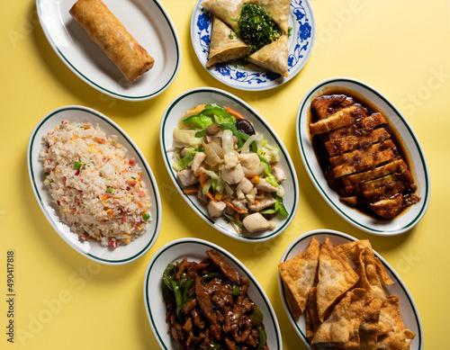 Typical Chinese food on yellow background photo