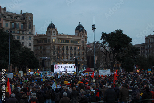 Photography Barcelona, Spain - 03-02-2022: The crowd holding protest banners during the demonstration against the war between Russia and Ukrania held in Catalonia Square (Barcelona city centre)