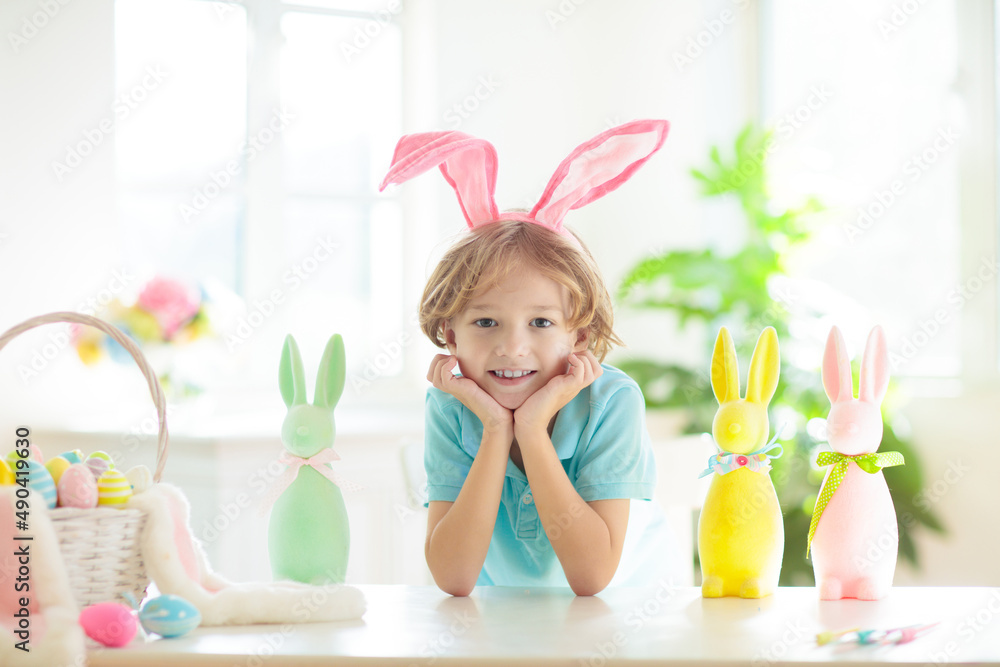 Kids on Easter egg hunt. Children dye eggs. Kids on Easter egg hunt. Children dye eggs.