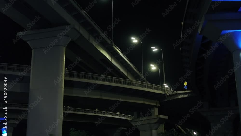Darnitsky automobile bridge. The city of Kiev. Ukraine. Across the Dnieper River. Video from the drone. Top view of the exits from the bridge. Night. Denouement. Traffic Darnitsky automobile bridge. The city of Kiev. Ukraine. Across the Dnieper River. Video from the drone. Top view of the exits from the bridge. Night. Denouement. Traffic