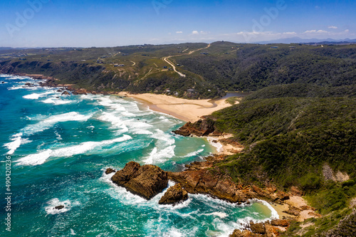 Aerial photo of the rugged coastline of Knysna, Western Cape, South Africa.  Photo taken using a drone over the cliffs, beaches and coastline.