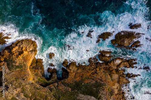 Aerial photo of the rugged coastline of Knysna, Western Cape, South Africa.  Photo taken using a drone over the cliffs, beaches and coastline.