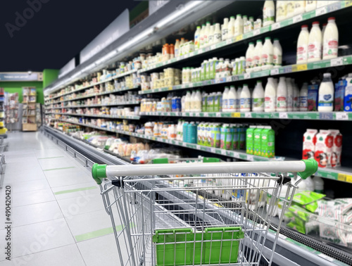 empty grocery cart in an empty supermarket