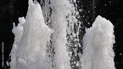 Spring water in sun light, slow motion footage.