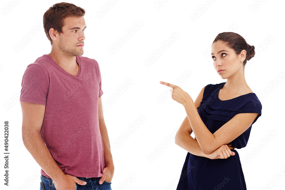 In the dog box. Cropped shot of a gorgeous young couple arguing while standing in a studio-isolated on white. In the dog box. Cropped shot of a gorgeous young couple arguing while standing in a studio-isolated on white.