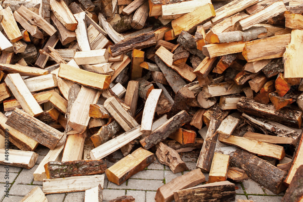 Background in the form of firewood chopped for heating the house. Background in the form of firewood chopped for heating the house.