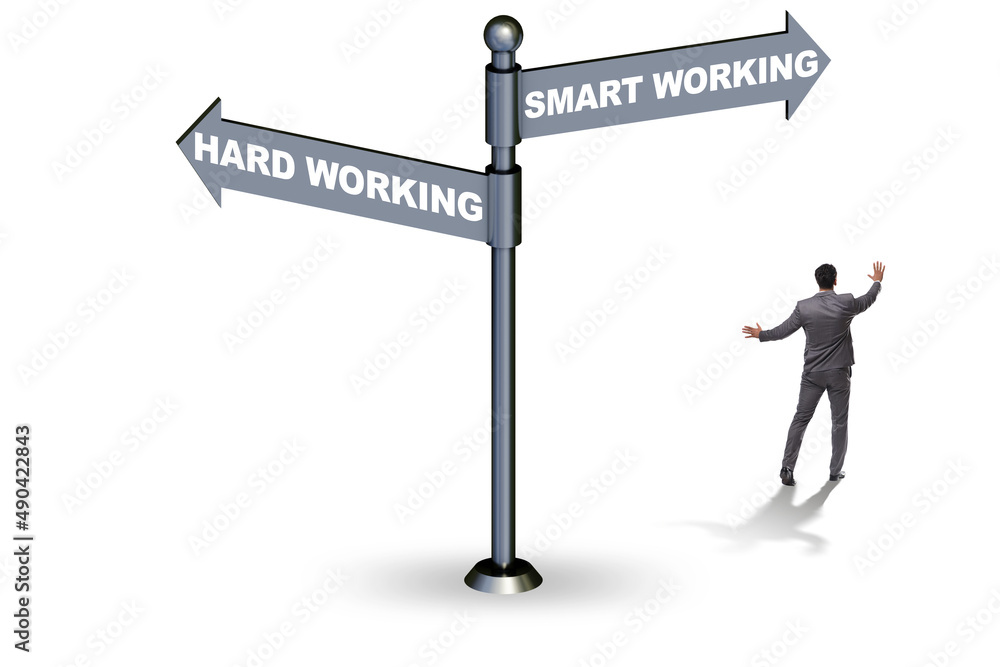 Businessman at the crossroads on working smart or hard Businessman at the crossroads on working smart or hard