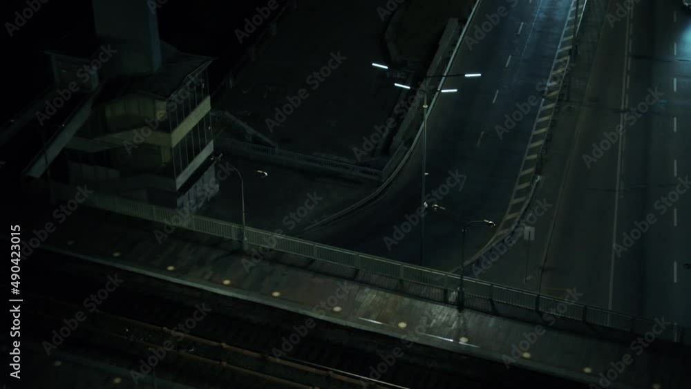 Darnitsky automobile bridge. The city of Kiev. Ukraine. Across the Dnieper River. Video from the drone. Top view of the exits from the bridge. Night. Denouement. Traffic Darnitsky automobile bridge. The city of Kiev. Ukraine. Across the Dnieper River. Video from the drone. Top view of the exits from the bridge. Night. Denouement. Traffic