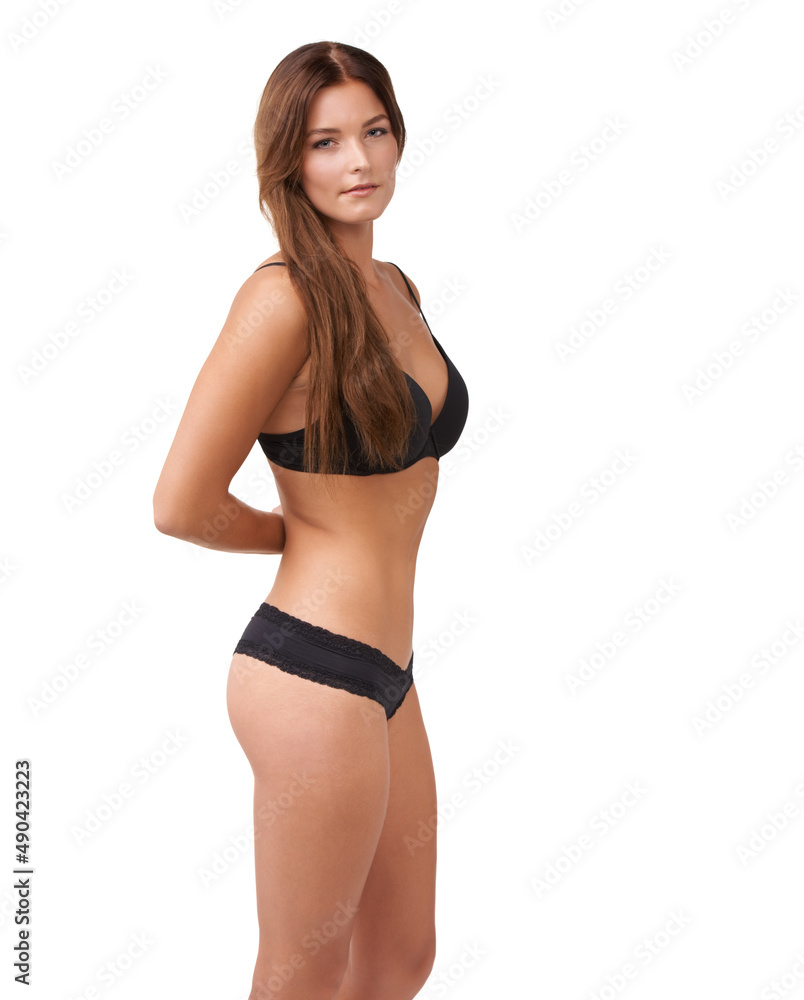 Looking good. Cropped shot of an attractive young woman posing in lingerie against white background. Looking good. Cropped shot of an attractive young woman posing in lingerie against white background.