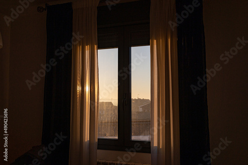  window on a sunny morning with white curtains background