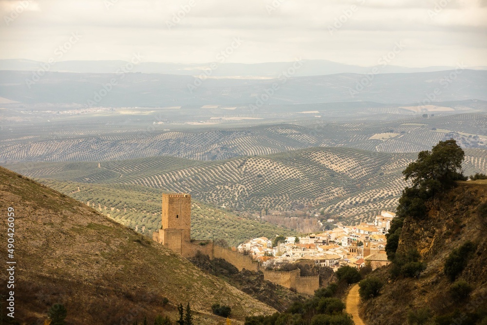 Aerial view of Cazorla stone town in the province of Jaén, Andalusia on a background of olive tree plantations on the hills
