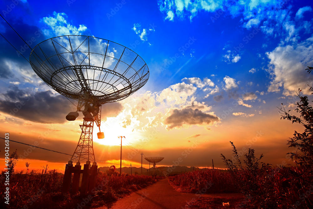 The silhouette of a radio telescope observatory The silhouette of a radio telescope observatory