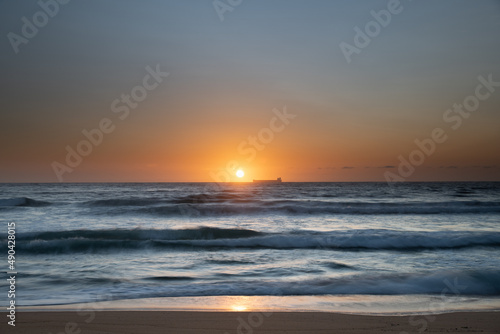 Sun, sand, ship sunrise seascape © Merrillie