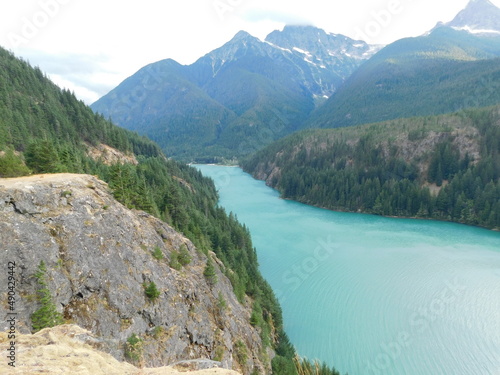 Turquoise Diablo Lake with snowy mountains in the background