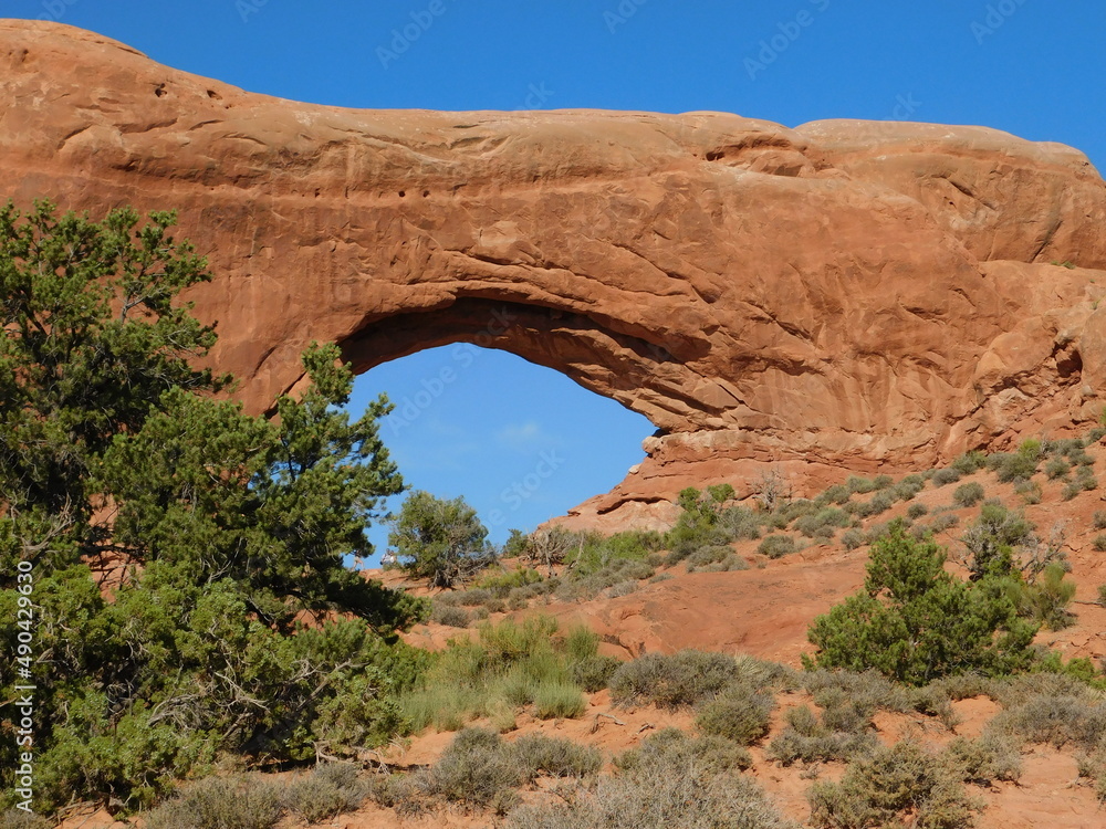 Sandstone arch towers over the Utah desert