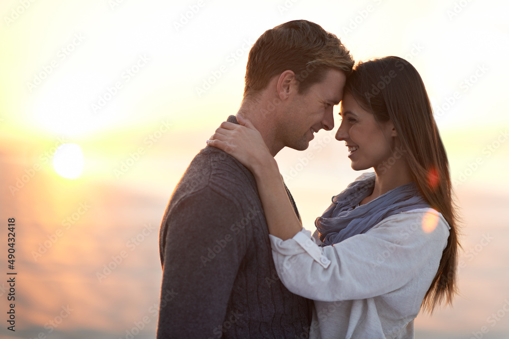 Theres nothing like young love. A young couple enjoying a romantic moment together at the beach. Theres nothing like young love. A young couple enjoying a romantic moment together at the beach.