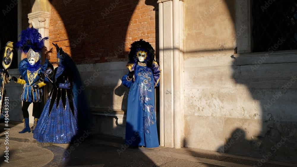 Venice, Italy - February 2022 - carnival masks are photographed with tourists in San Marco square
Venice, Italy - February 2022 - carnival masks are photographed with tourists in San Marco square