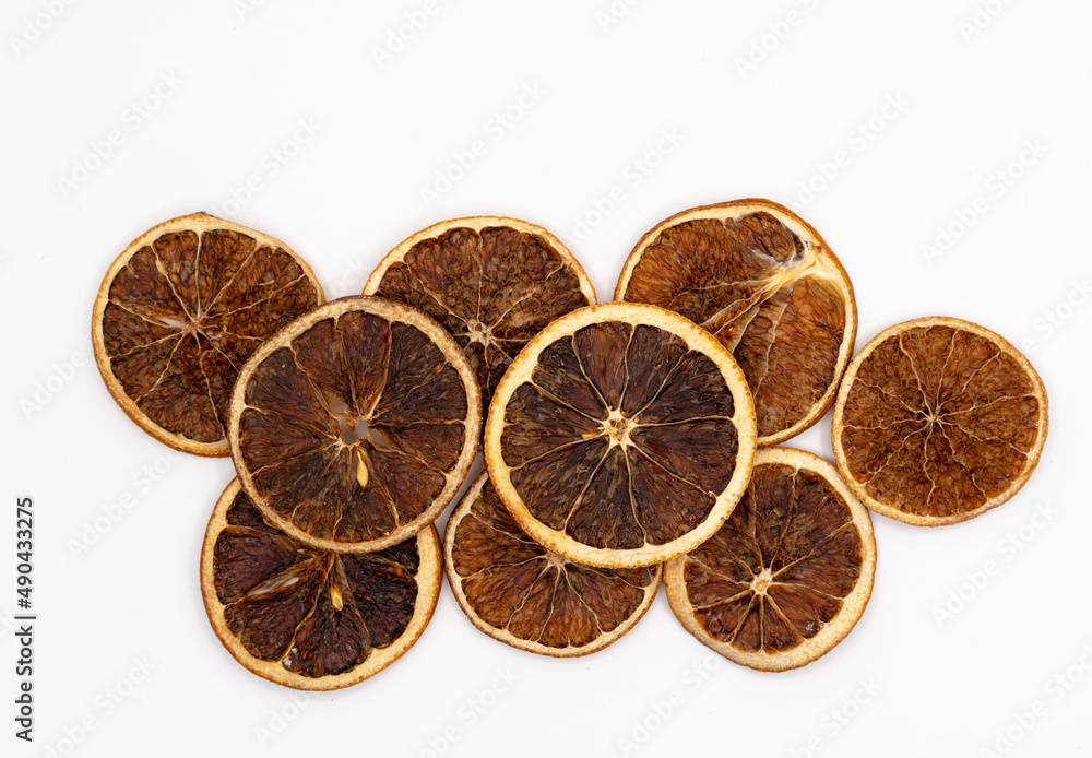 Dried orange slices isolated on a white background. Orange fruit chips. Dried orange slices isolated on a white background. Orange fruit chips.