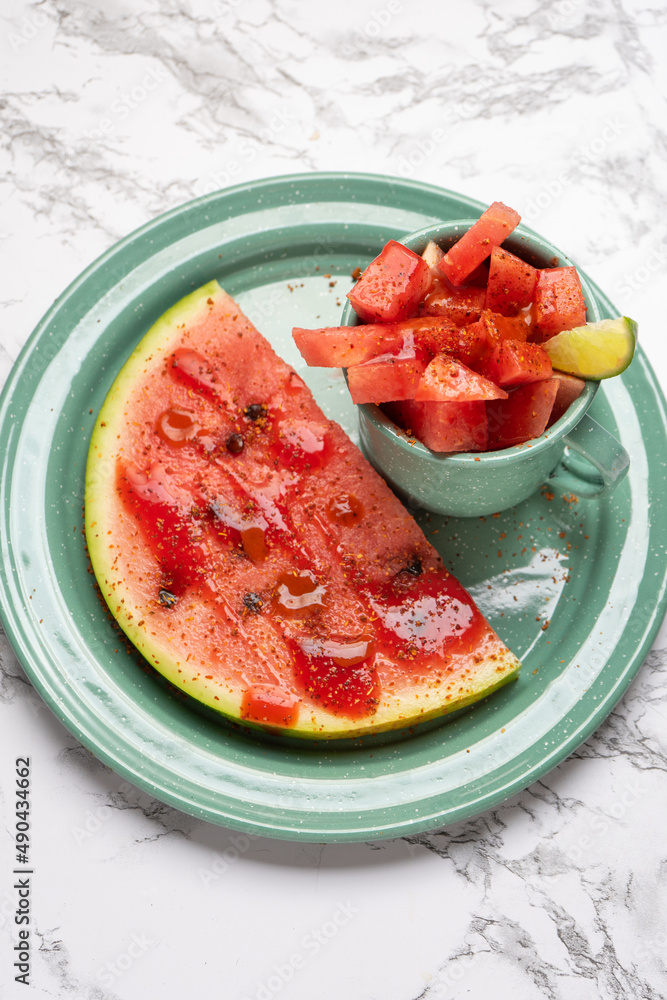 Watermelon with chili powder and chamoy. Mexican food Stock Photo