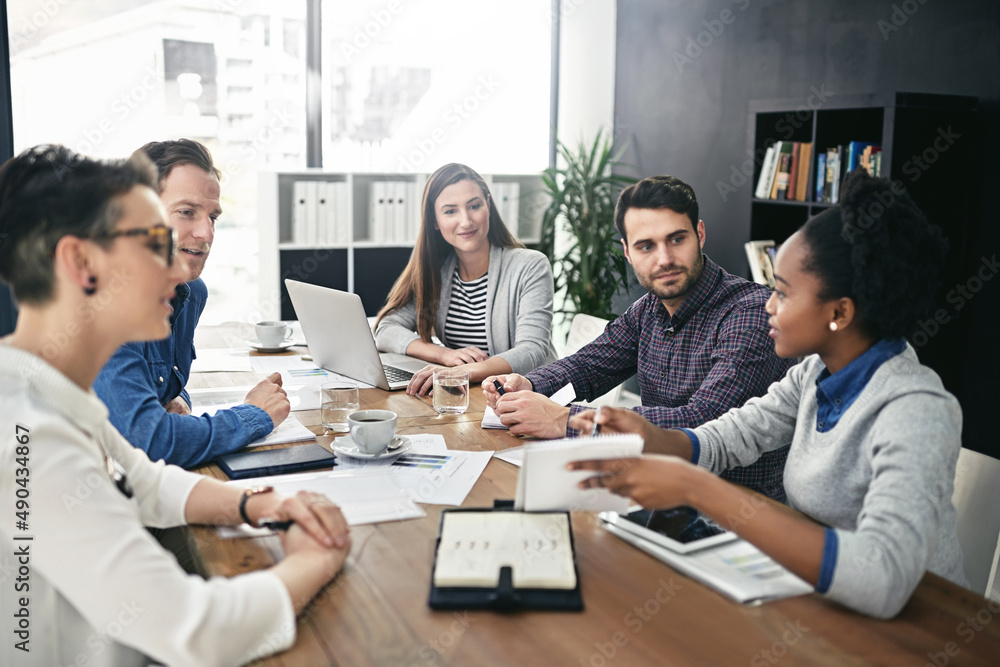 Utilizing the knowledge, experience and skills of everyone involved. Shot of a group of businesspeople having a meeting. Utilizing the knowledge, experience and skills of everyone involved. Shot of a group of businesspeople having a meeting.