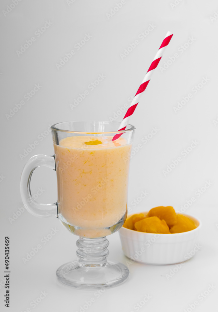 Yellow Indian mango yoghurt drink Mango Lassi or smoothie with turmeric and saffron. Yellow Indian mango yoghurt drink Mango Lassi or smoothie with turmeric and saffron.