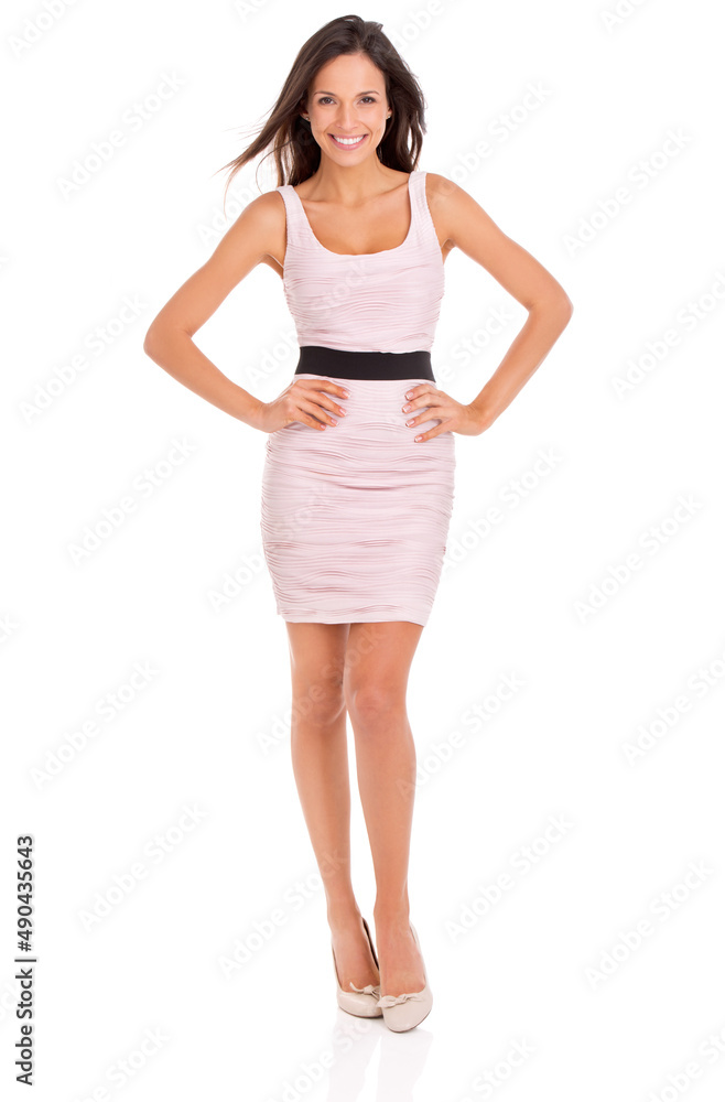 Looking good in her summer wear. Full-length studio portrait of a beautiful young woman posing in a pink dress. Looking good in her summer wear. Full-length studio portrait of a beautiful young woman posing in a pink dress.