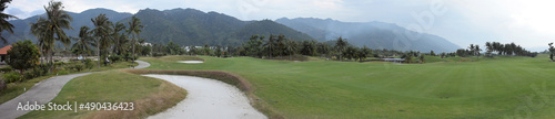 Panorama of the golf course on the background of the mountains