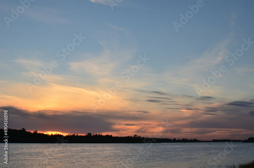 Evening sky over the Irtysh river in the Omsk region. Russia