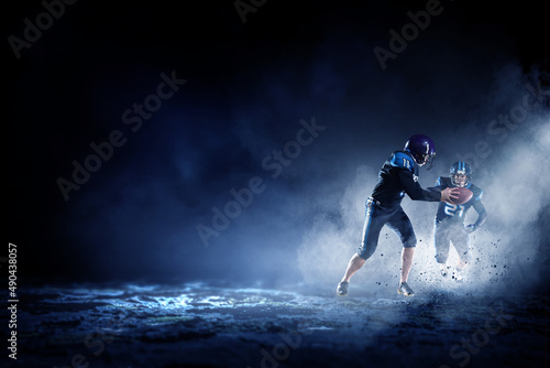 Businessman acting as american football players photo