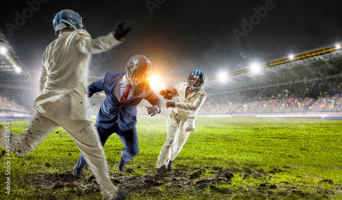 Businessman acting as american football players © Sergey Nivens