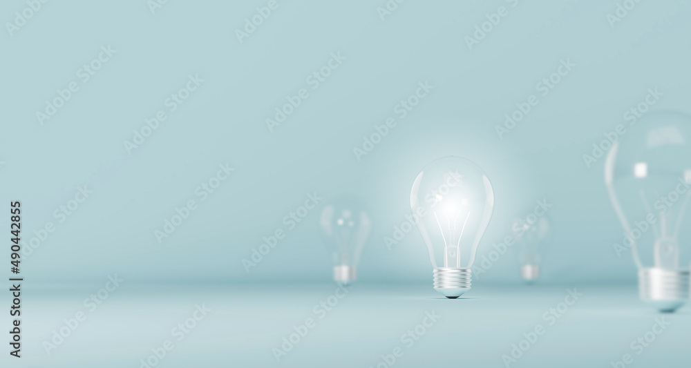 Light bulb bright outstanding among lightbulb on light blue background. Concept of creative idea and innovation, Unique, Think different, Individual and standing out from the crowd. 3d illustration Light bulb bright outstanding among lightbulb on light blue background. Concept of creative idea and innovation, Unique, Think different, Individual and standing out from the crowd. 3d illustration