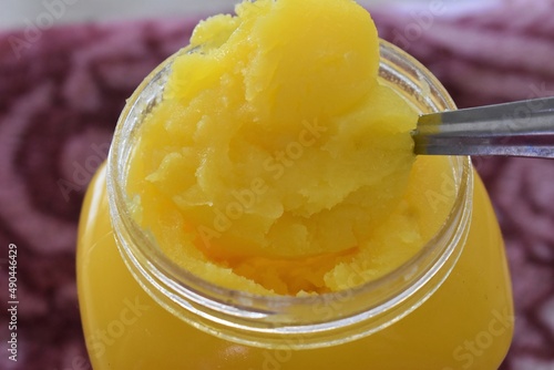 Clarified Liquid Butter also known as Shudh Desi Ghee in India closeup background photo