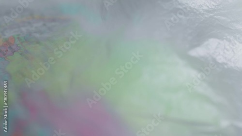 A dark garbage bag or polyethylene covers globus