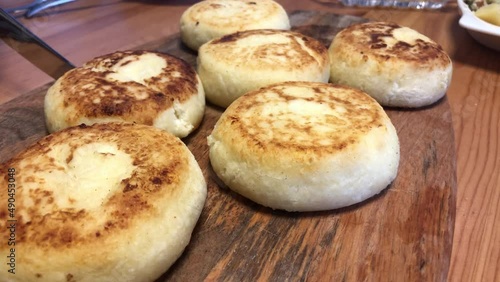 Wallpaper Mural Crop woman cutting syrniki on table Torontodigital.ca