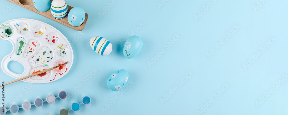 Preparation for Easter Holiday. Flat lay composition with painting Easter eggs. Top view. Banner Preparation for Easter Holiday. Flat lay composition with painting Easter eggs. Top view. Banner