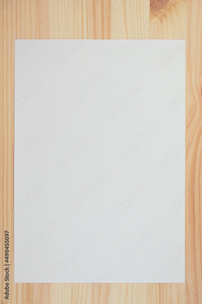 white paper on wood table