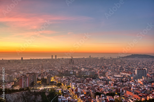 Beautiful sunrise in Barcelona seen from a viewpoint in the hills © elxeneize