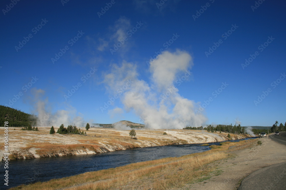 Volcanic steam in the banks of Firehole river at Upper Geyser Basin, Yellowstone National Park Volcanic steam in the banks of Firehole river at Upper Geyser Basin, Yellowstone National Park