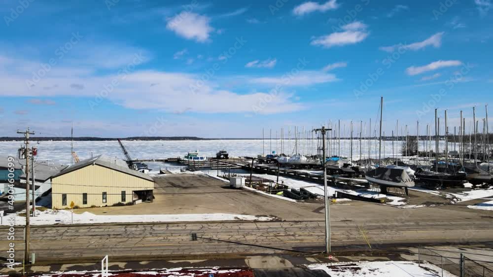Drone rising upward over Muskegon Lake Covered in ice. Drone rising upward over Muskegon Lake Covered in ice.