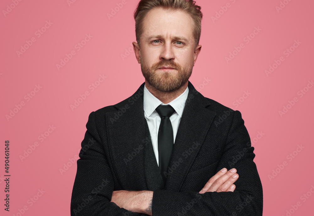 Serious businessman looking at camera Serious businessman looking at camera