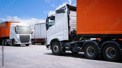 Semi Trailer Trucks The Parking lot at The Warehouse. Delivery Container Trucks. Cargo Shipping. Lorry. Industry Freight Truck Logistics Cargo Transportation	
