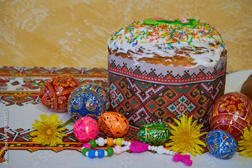 Ukrainian Easter cake,Traditional ukrainian easter cake with white meringu. Spring colorful painted eggs.