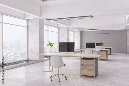 Bright concrete office interior with panoramic city view  desktop with computer and daylight. 3D Rendering.