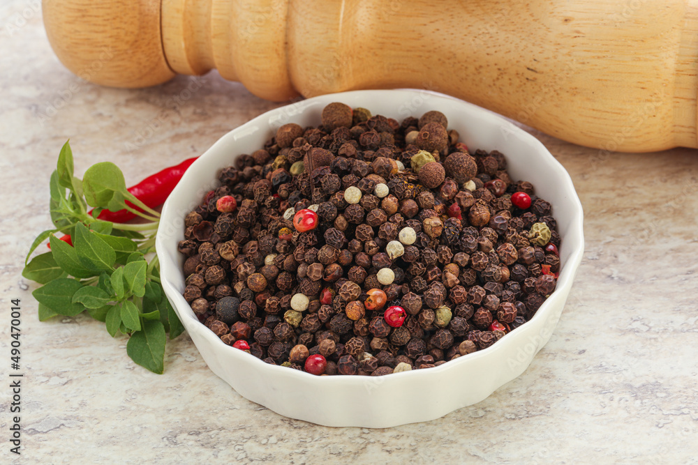 Peppercorn mix heap in the bowl Peppercorn mix heap in the bowl