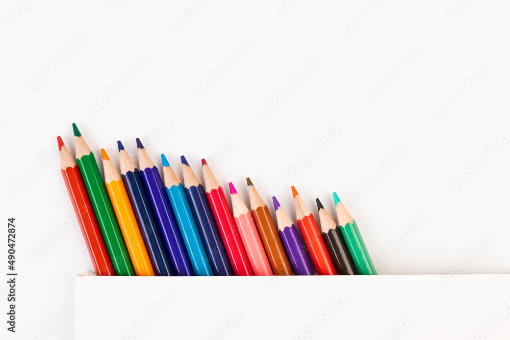 Fototapeta premium Many multicolored pencils, isolated on white background with copy space. Art and education background.